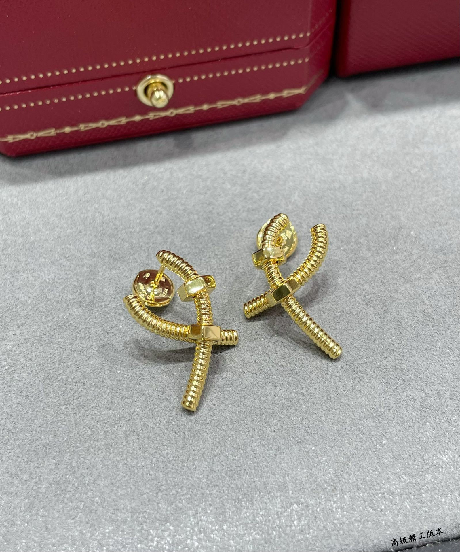 Ca*t*er cross screw earrings