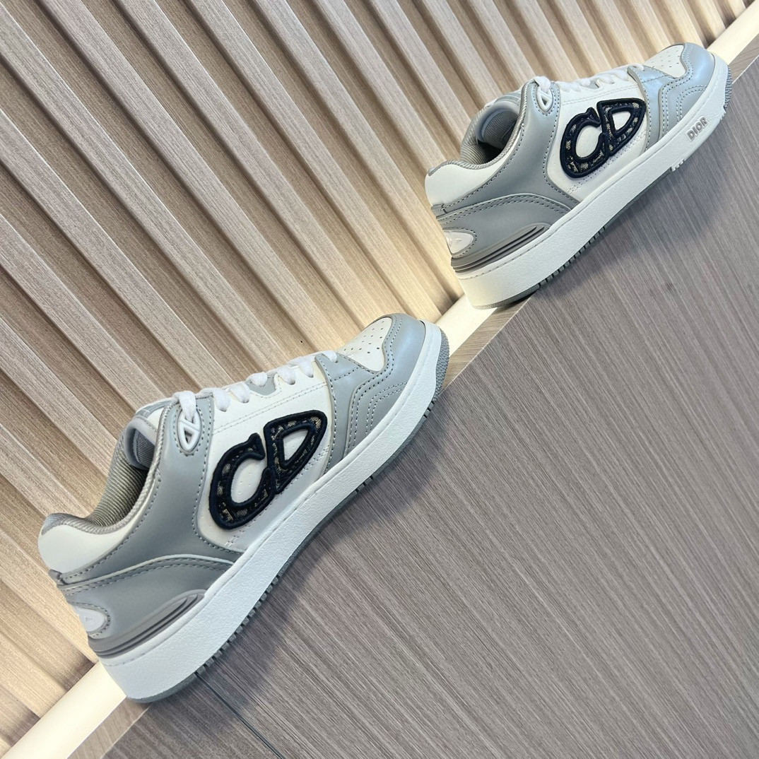 ua D*or b57 low-top sneaker gray and white