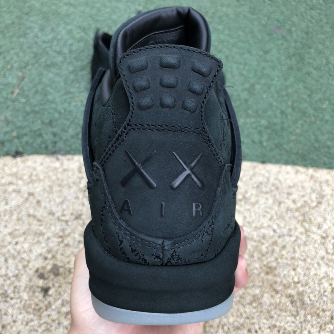 UA Jordan 4 Retro Kaws Black