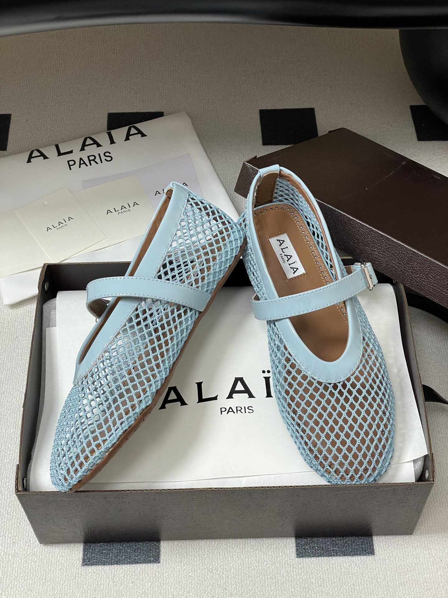 UA ALAÏA BALLET FLATS IN FISHNET